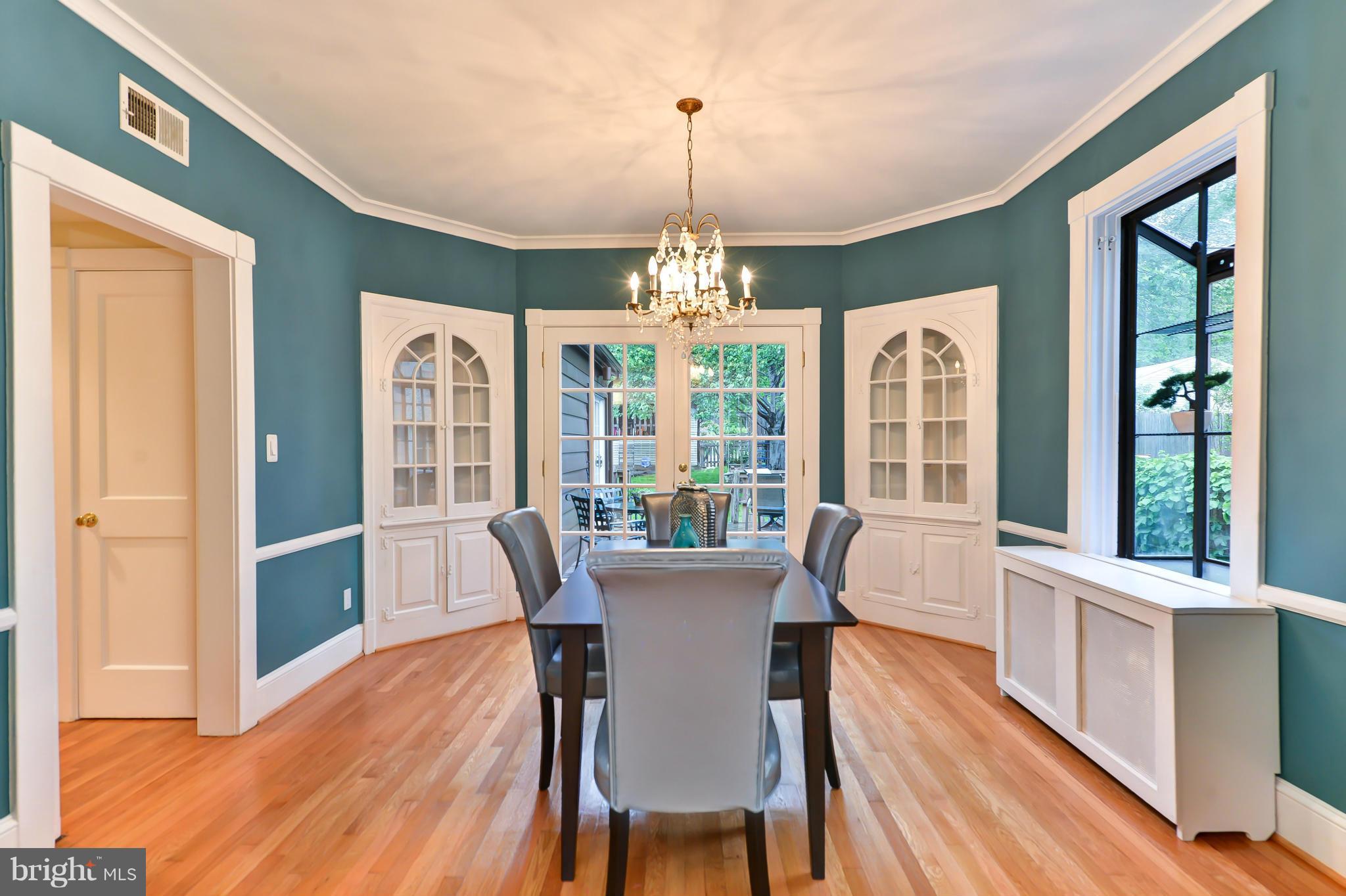 3339 Military Road Northwest Washington, DC 20015 - Photo 7 of 30 a view of a dining room with furniture wooden floor and chandelier