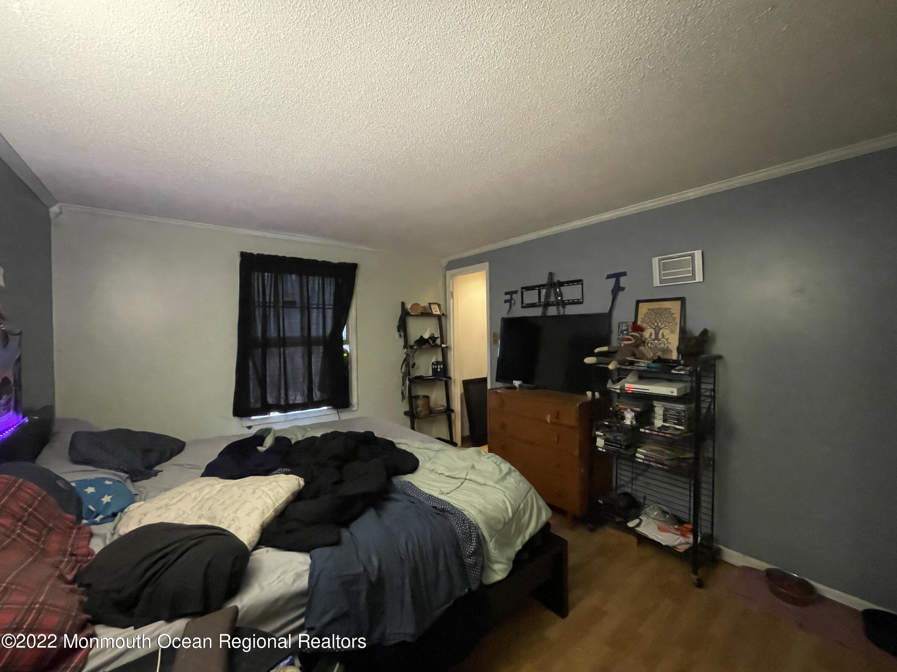 330 Ridge Road Browns Mills, NJ 08015 - Photo 13 of 33 a bedroom with a bed and a window