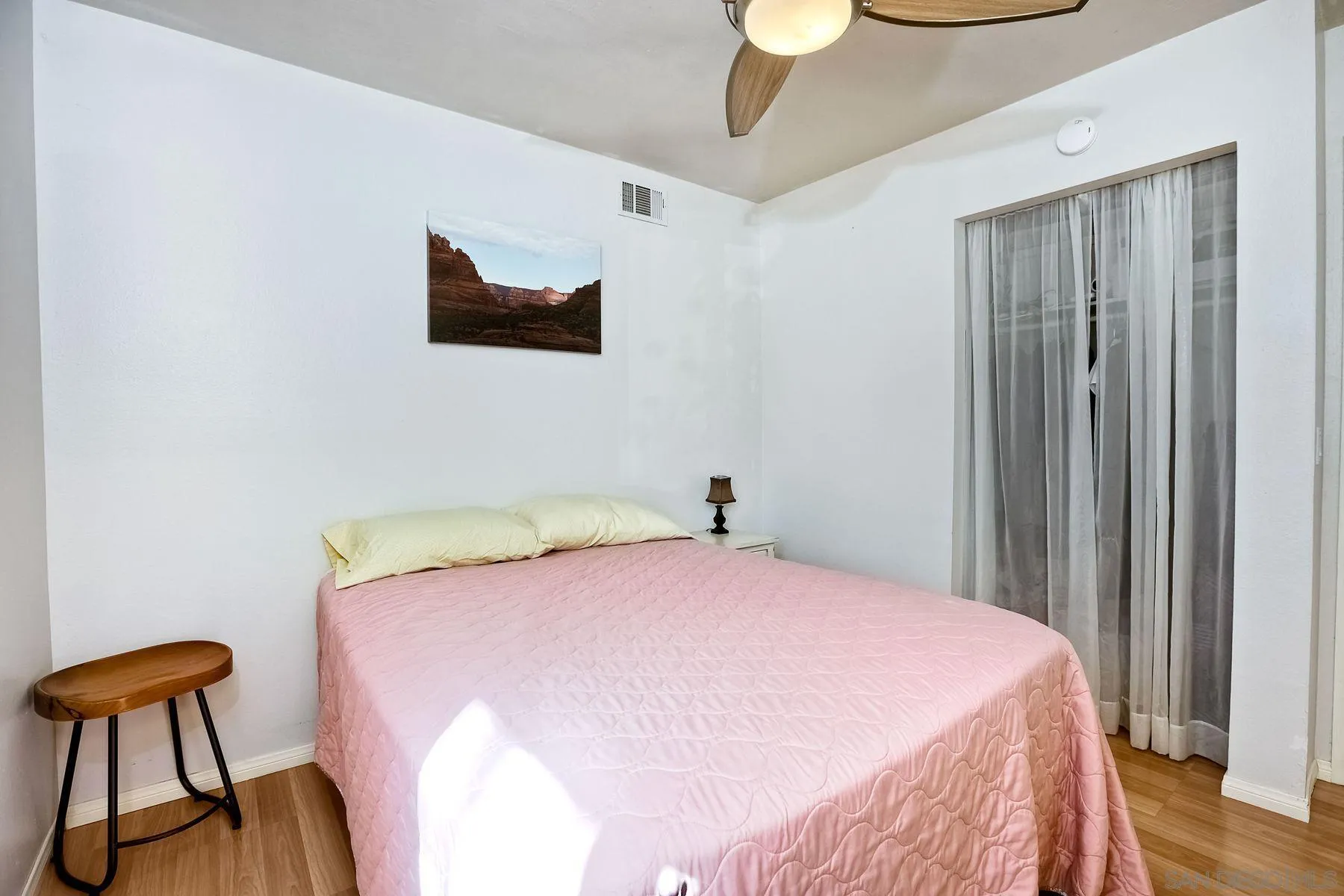 14051 Olive Meadows Place Poway, CA 92064 - Photo 14 of 33 a bedroom with a bed and a chair