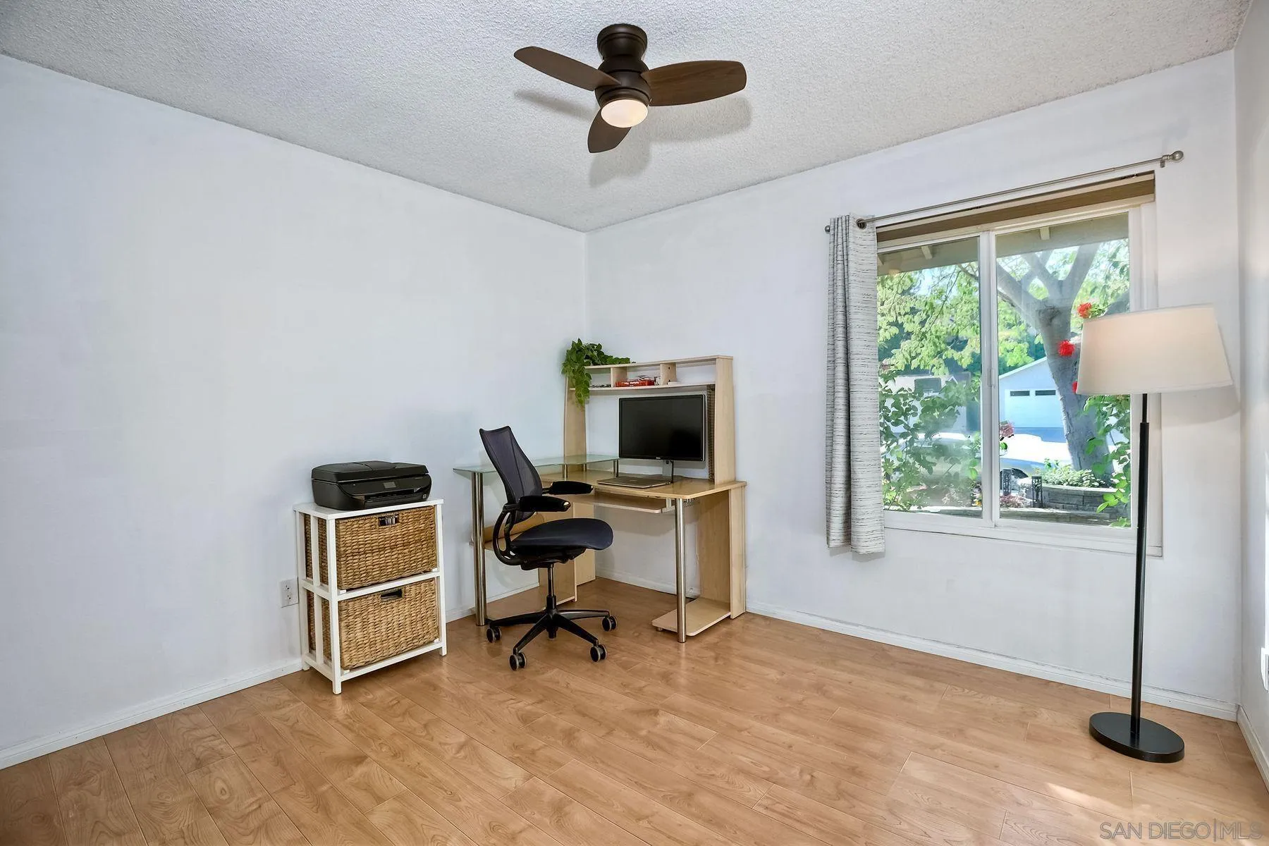 14051 Olive Meadows Place Poway, CA 92064 - Photo 15 of 33 a view of a workspace with furniture and a window