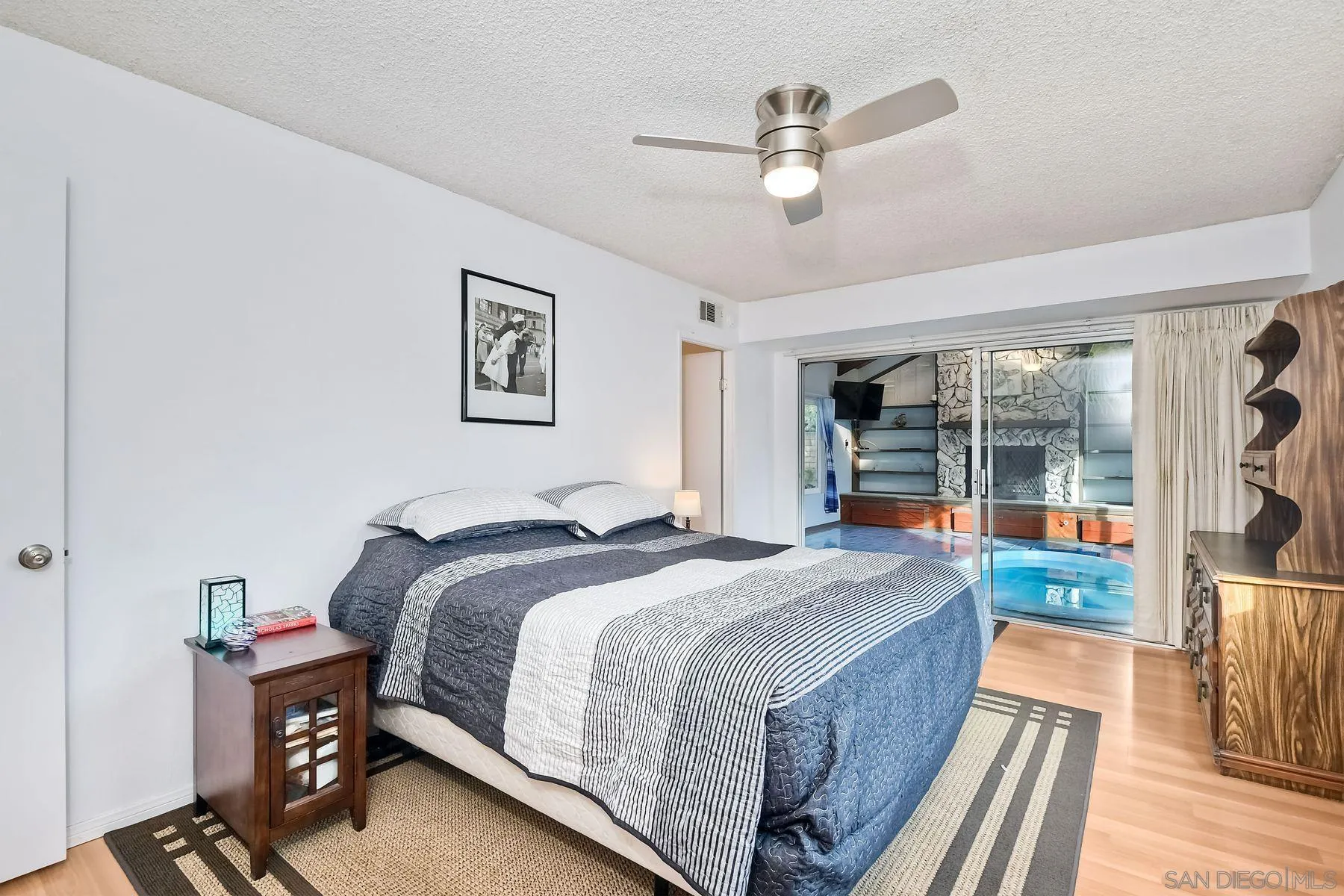 14051 Olive Meadows Place Poway, CA 92064 - Photo 19 of 33 a spacious bedroom with a bed and a large window