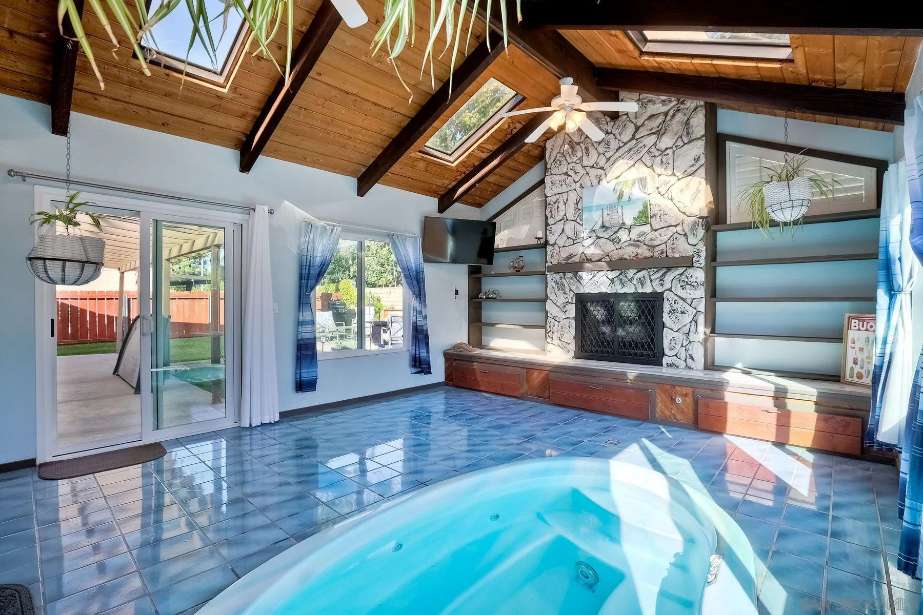 14051 Olive Meadows Place Poway, CA 92064 - Photo 25 of 33 a view of an empty room with wooden floor and a fireplace