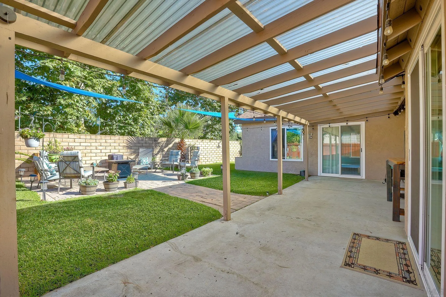 14051 Olive Meadows Place Poway, CA 92064 - Photo 26 of 33 a view of a porch with a garden