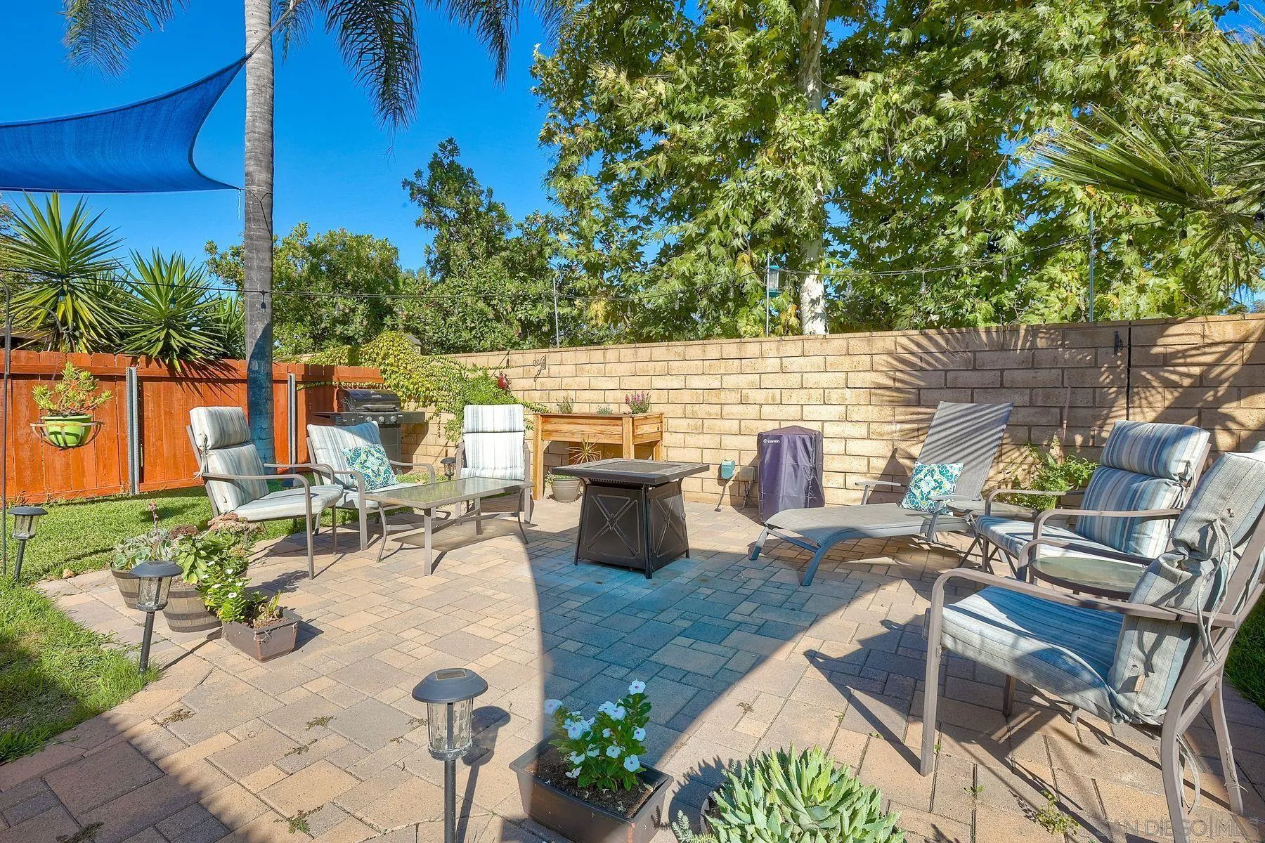 14051 Olive Meadows Place Poway, CA 92064 - Photo 27 of 33 a view of a backyard with sitting area