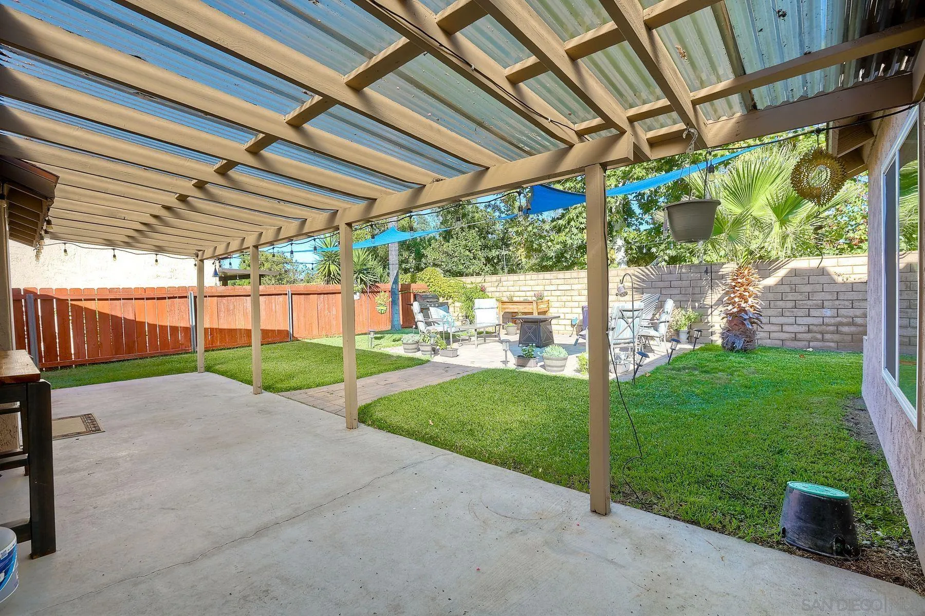 14051 Olive Meadows Place Poway, CA 92064 - Photo 29 of 33 a view of a backyard with porch