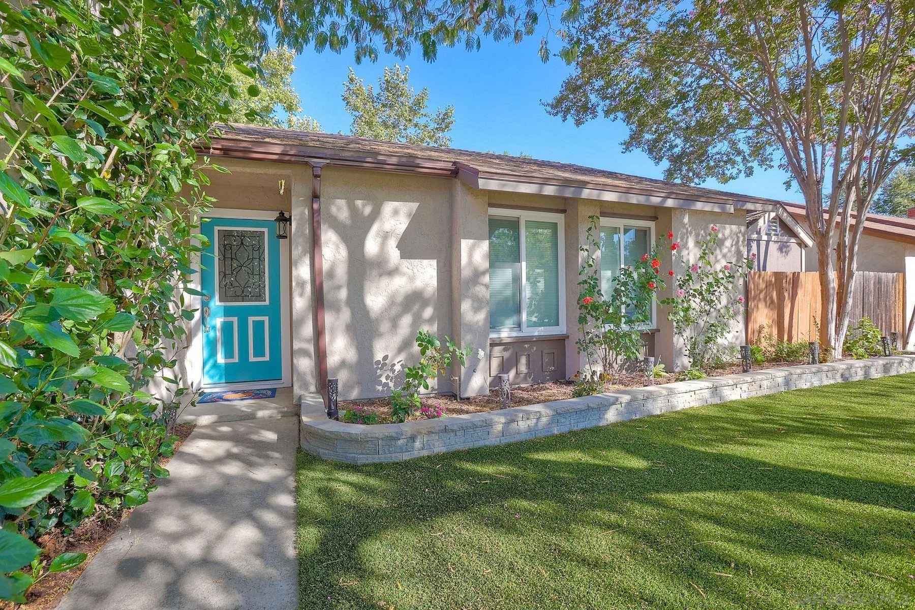 14051 Olive Meadows Place Poway, CA 92064 - Photo 3 of 33 a front view of a house with garden