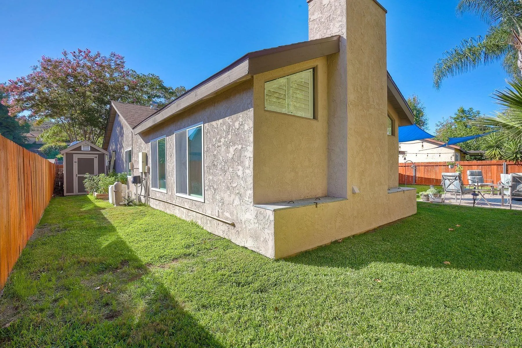 14051 Olive Meadows Place Poway, CA 92064 - Photo 31 of 33 a view of a backyard with plants and large tree