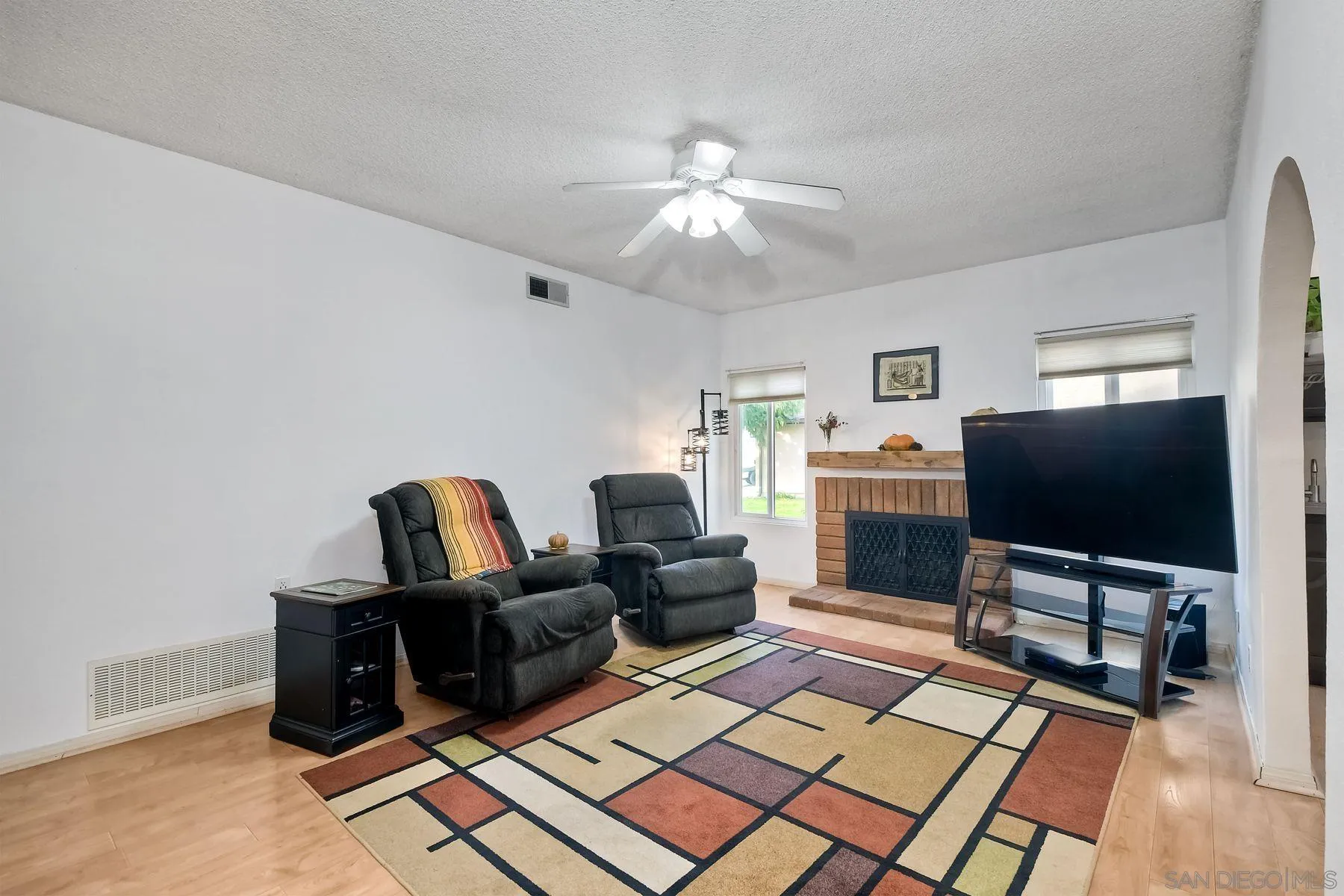 14051 Olive Meadows Place Poway, CA 92064 - Photo 5 of 33 a living room with furniture and a flat screen tv