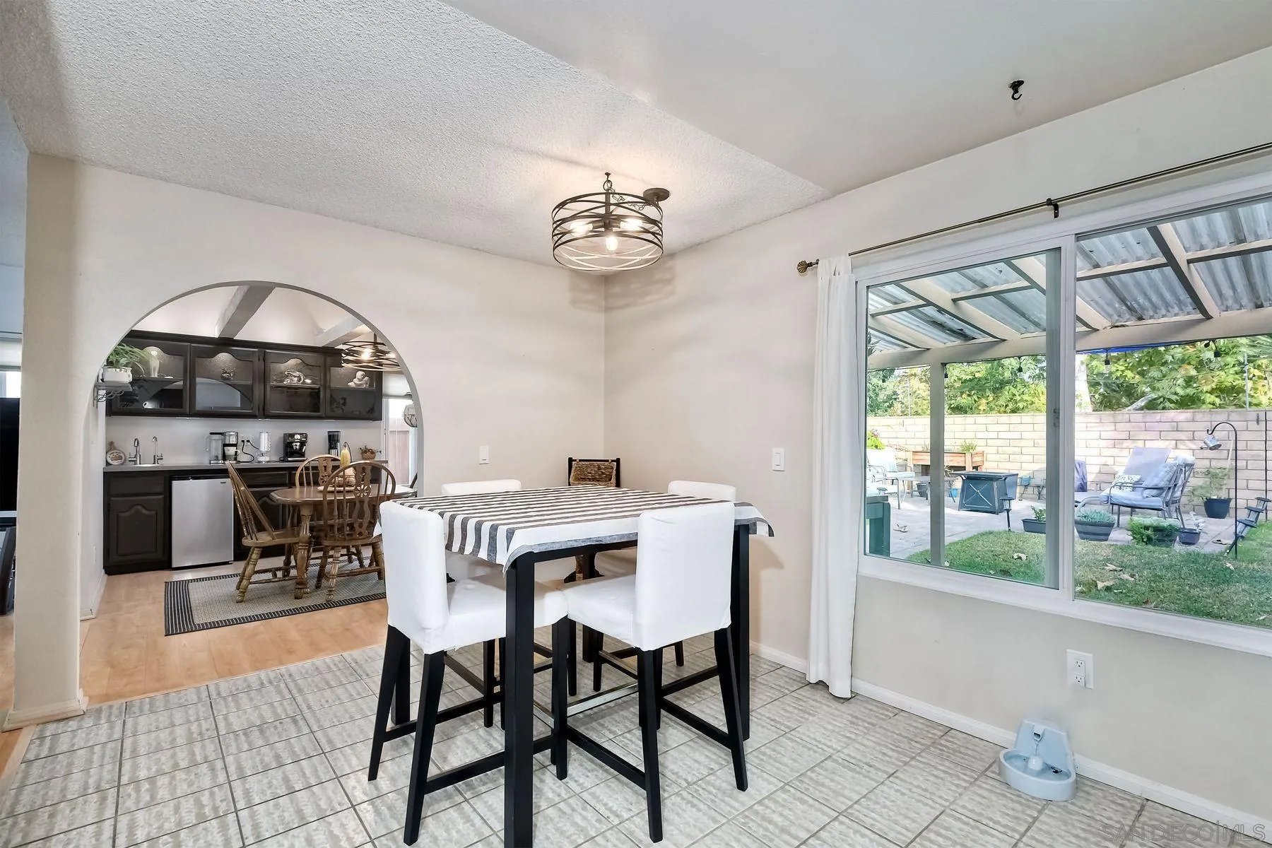 14051 Olive Meadows Place Poway, CA 92064 - Photo 9 of 33 a view of a dining room with furniture window and outside view