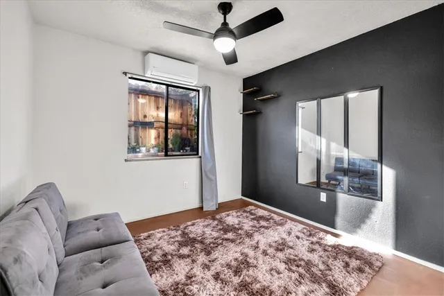 an empty room with windows and closet