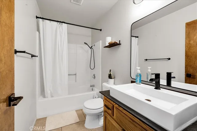 a view of a patio with a table and chairs