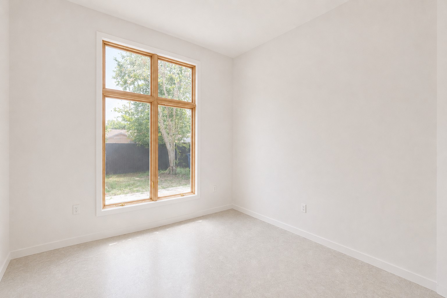 4603 Bucks Run Austin, TX 78744 - Photo 11 of 14 Room featuring a large wood-framed window, white walls, and light-toned flooring