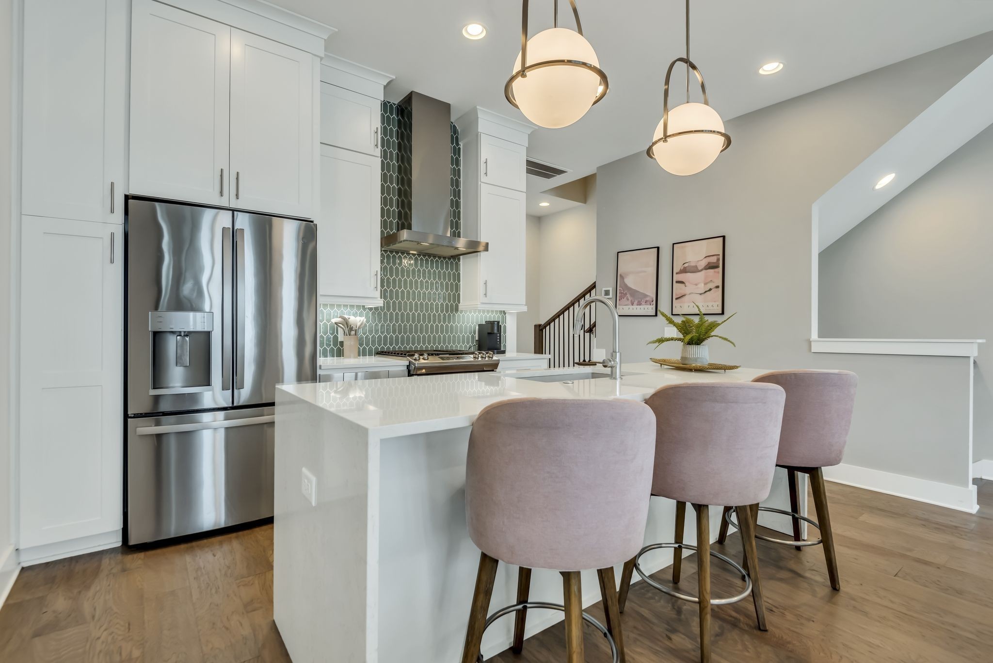 2176 Carson Street, Unit 24 Nashville, TN 37211 - Photo 20 of 36 a kitchen with stainless steel appliances granite countertop a sink dishwasher a refrigerator with wooden floor and chairs