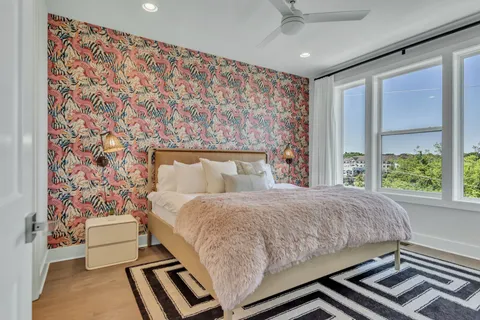 a bedroom with a bed and hallway