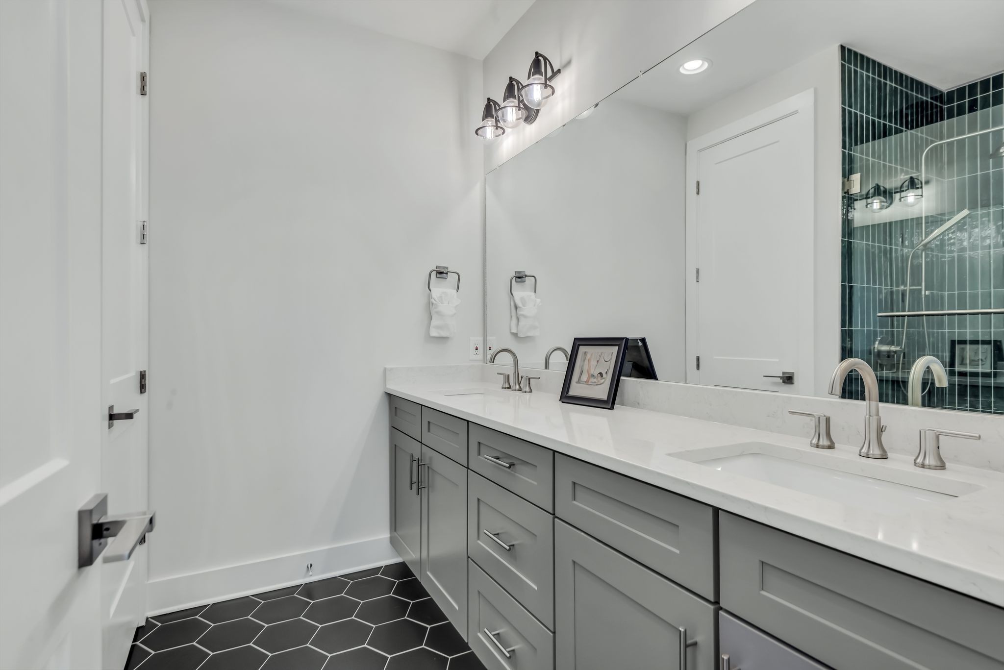 2176 Carson Street, Unit 24 Nashville, TN 37211 - Photo 35 of 36 a bathroom with a double vanity sink a toilet and a mirror