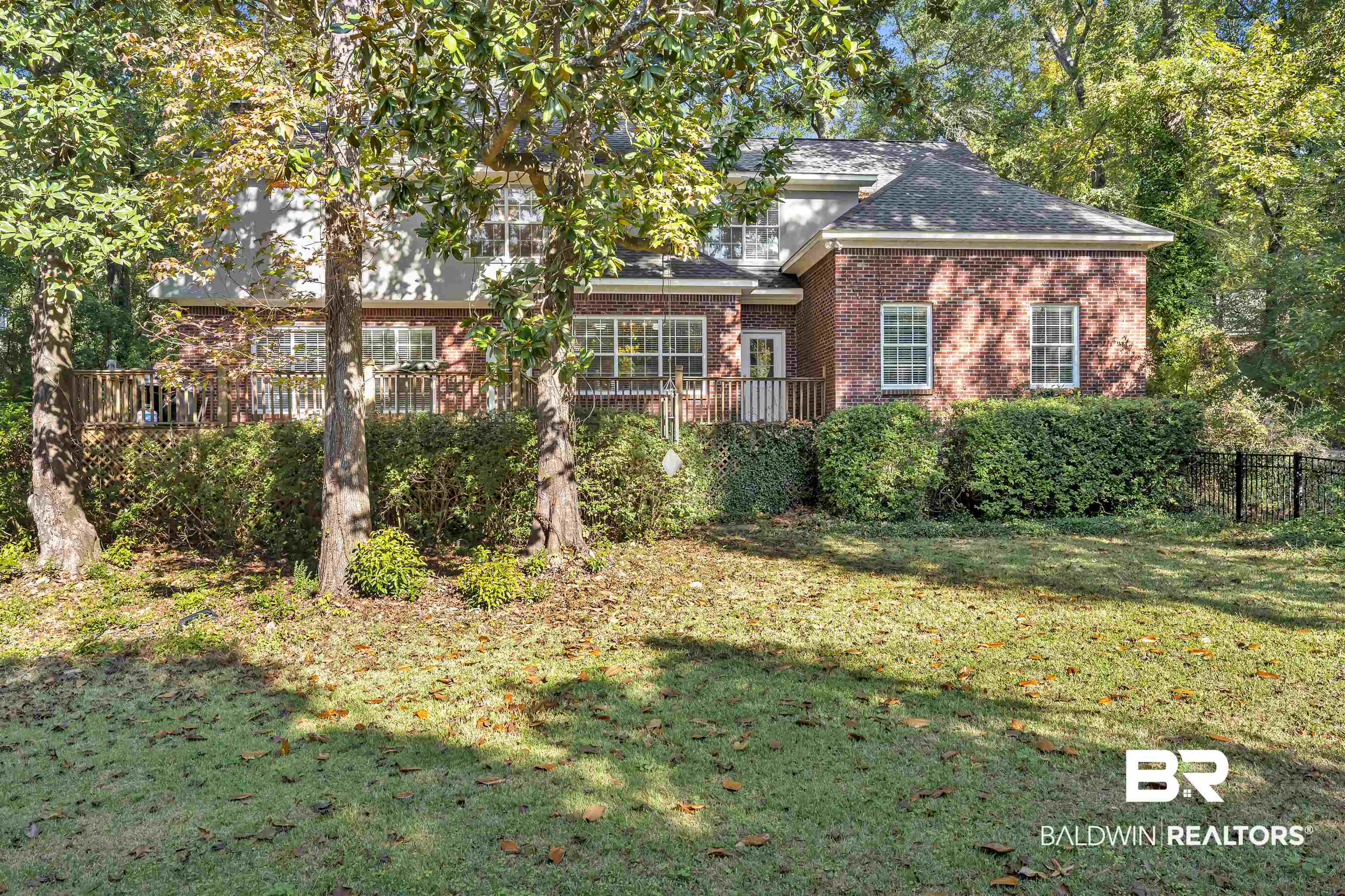 1262 Patrick Street Daphne, AL 36526 - Photo 34 of 35 View of front of house featuring brick siding, a front lawn, and roof with shingles