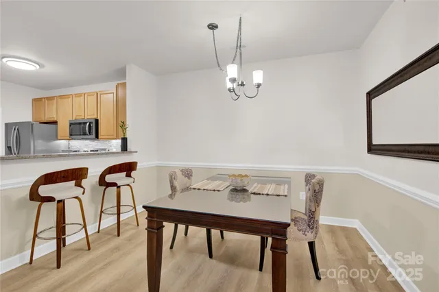 a view of a workspace with furniture and window