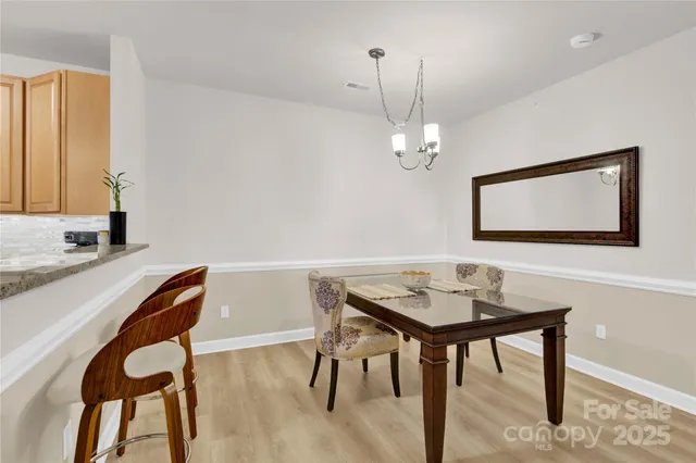 a spacious bedroom with a bed and a flat screen tv