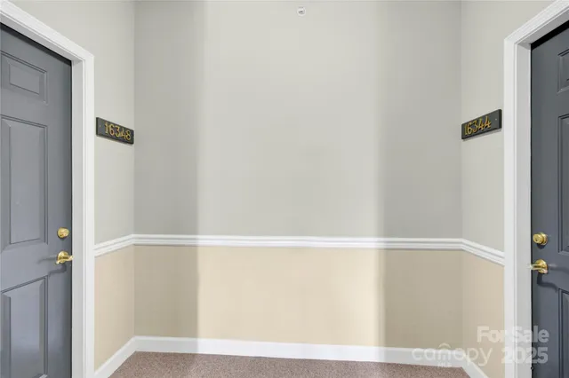 a view of a hallway with stairs