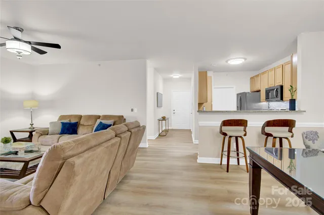 a bed room with furniture and a wooden floor