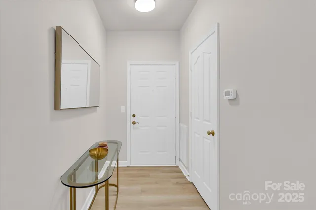 a kitchen with granite countertop a refrigerator sink and stove