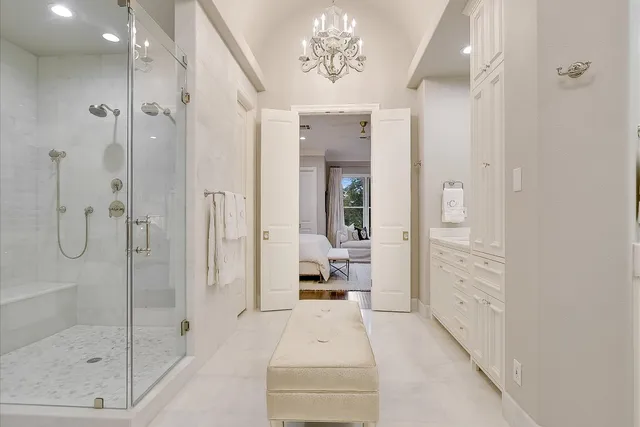 a bathroom with a glass shower door