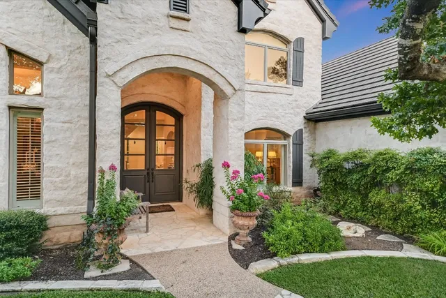a front view of a house with garden