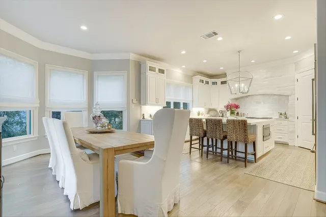 a kitchen with a table and chairs