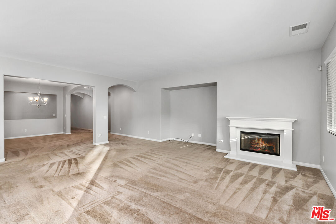 17037 Spring Canyon Place Riverside, CA 92503 - Photo 8 of 31 a view of empty room with a fireplace