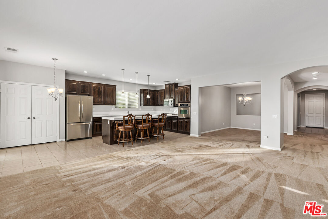 17037 Spring Canyon Place Riverside, CA 92503 - Photo 10 of 31 a view of kitchen with furniture and refrigerator