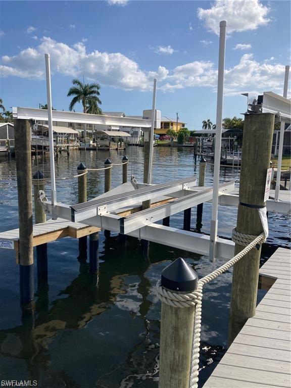 2849 Triggerfish Street Cape Coral, FL 33993 - Photo 2 of 11 a roof deck with table and chairs