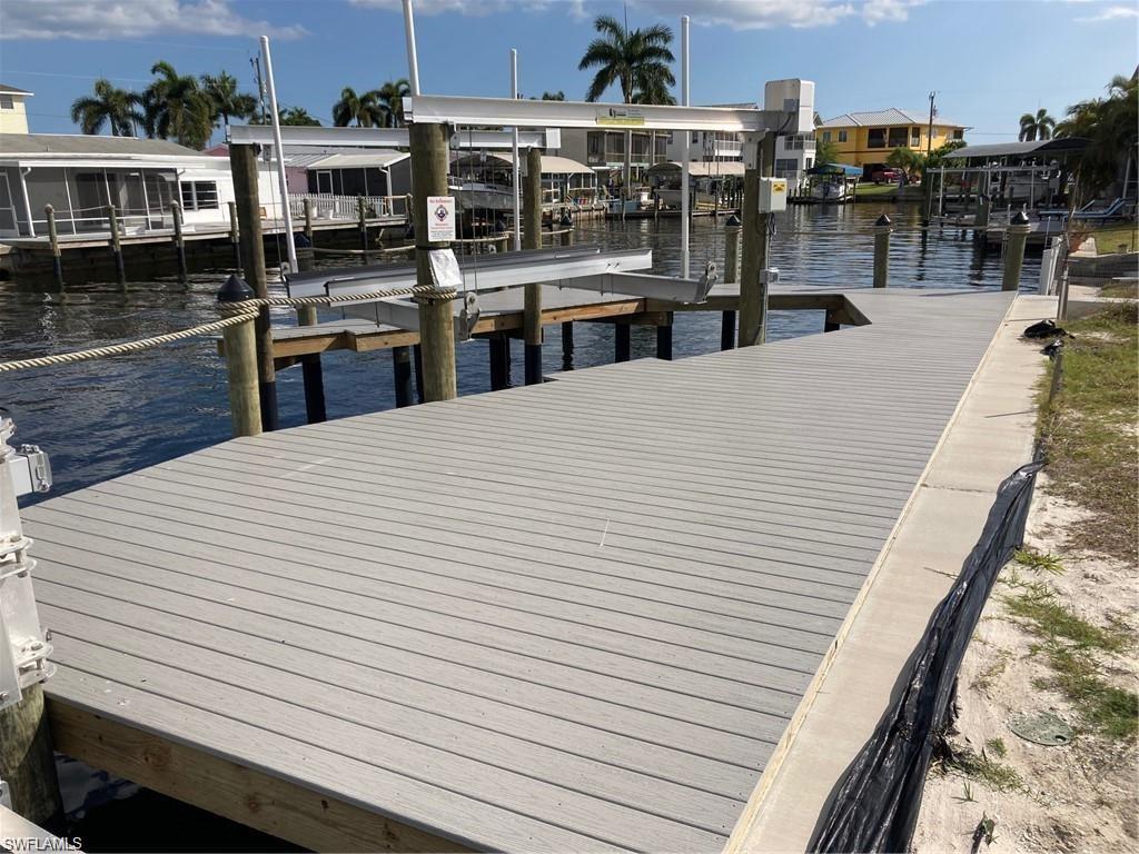 2849 Triggerfish Street Cape Coral, FL 33993 - Photo 4 of 11 a large white building with wooden floor
