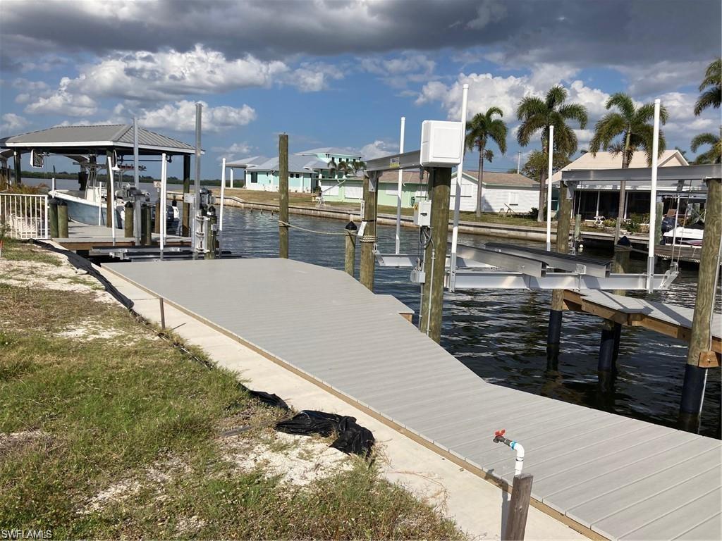 2849 Triggerfish Street Cape Coral, FL 33993 - Photo 8 of 11 a view of a patio with swimming pool