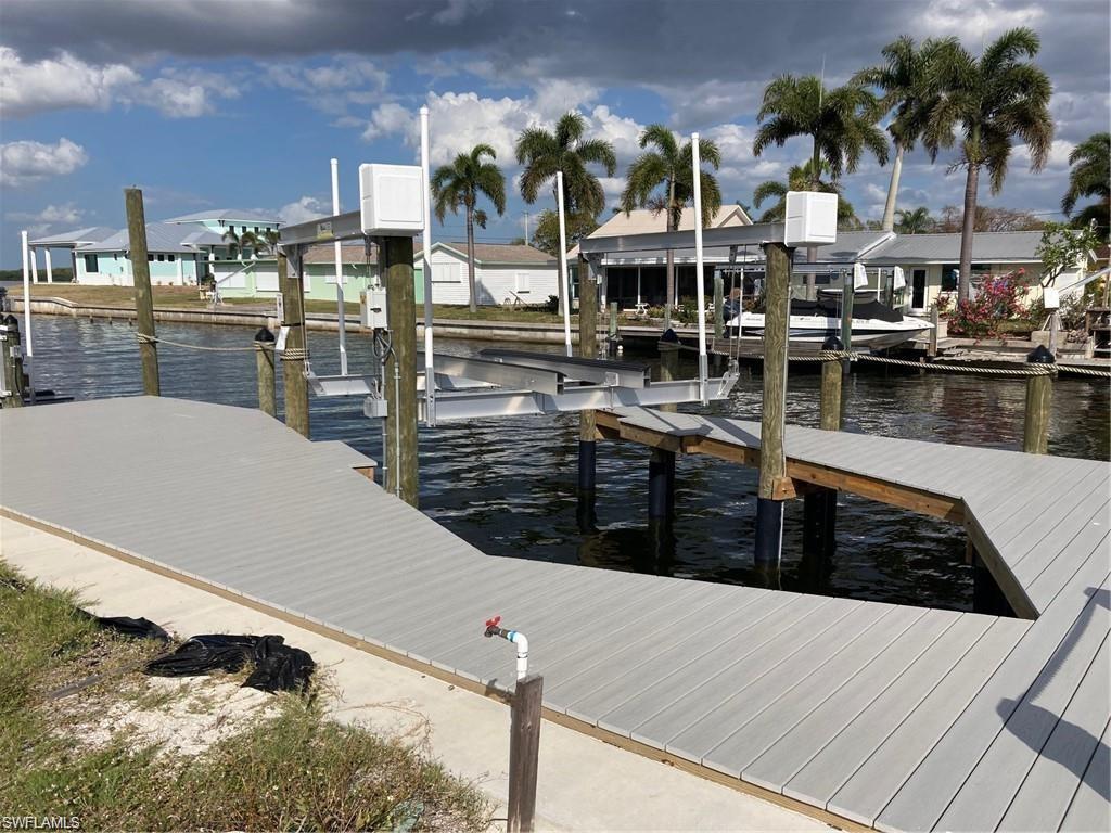2849 Triggerfish Street Cape Coral, FL 33993 - Photo 9 of 11 a view of a lake with outdoor space