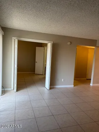 an empty room with a bathroom