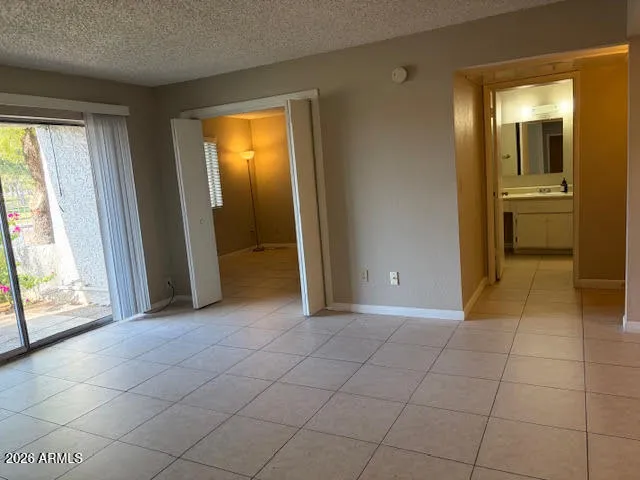 a view of a kitchen with wooden cabinets