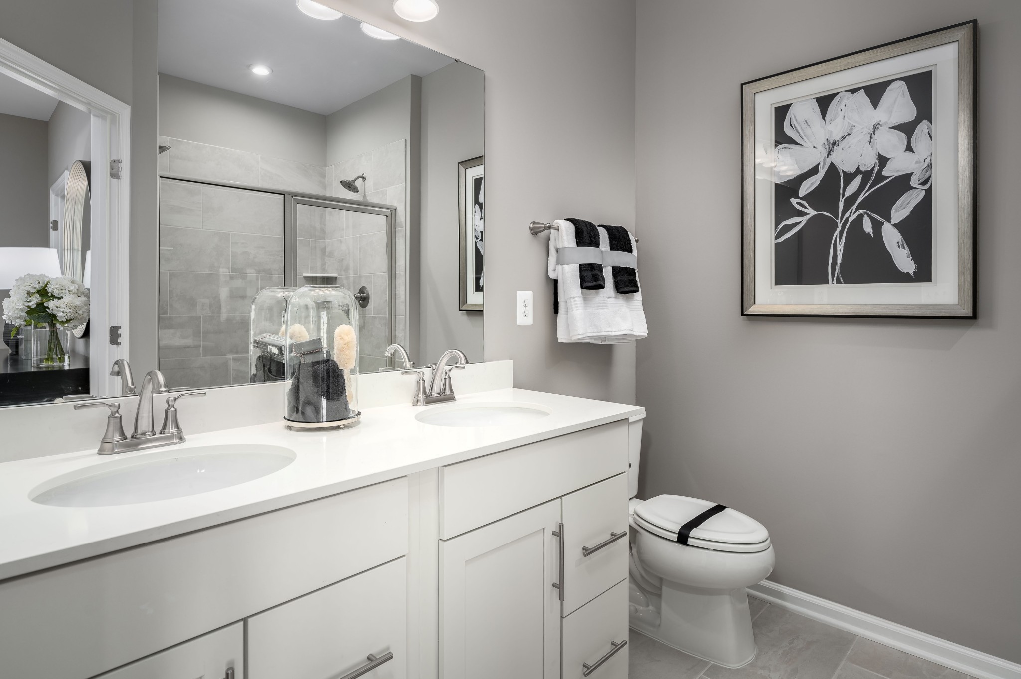 322 Poplar Loop Antioch, TN 37013 - Photo 12 of 20 a bathroom with a toilet sink and mirror