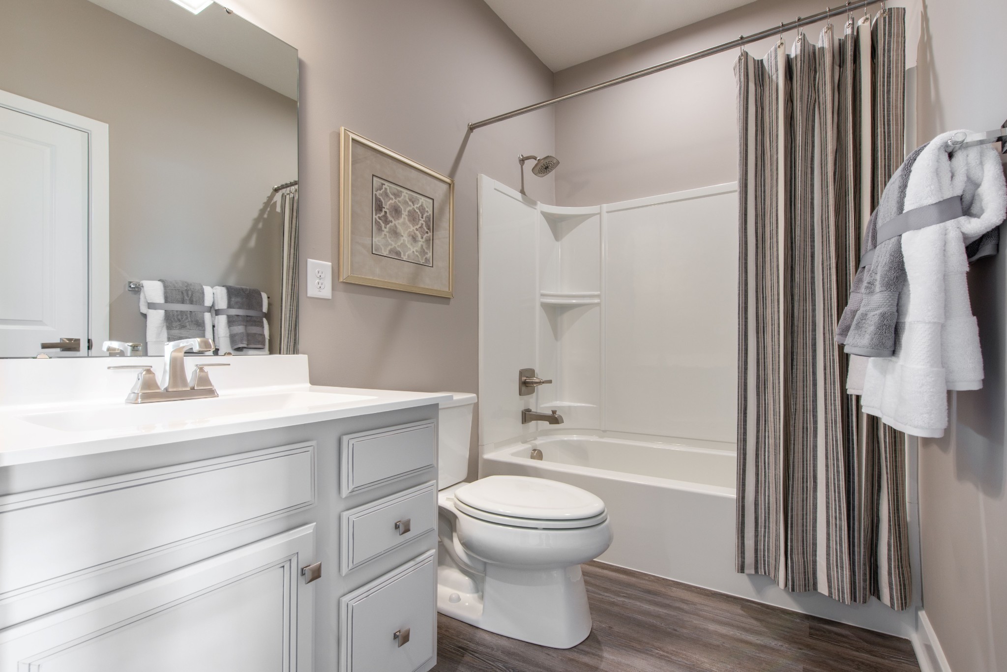 322 Poplar Loop Antioch, TN 37013 - Photo 15 of 20 a bathroom with a sink a toilet and shower