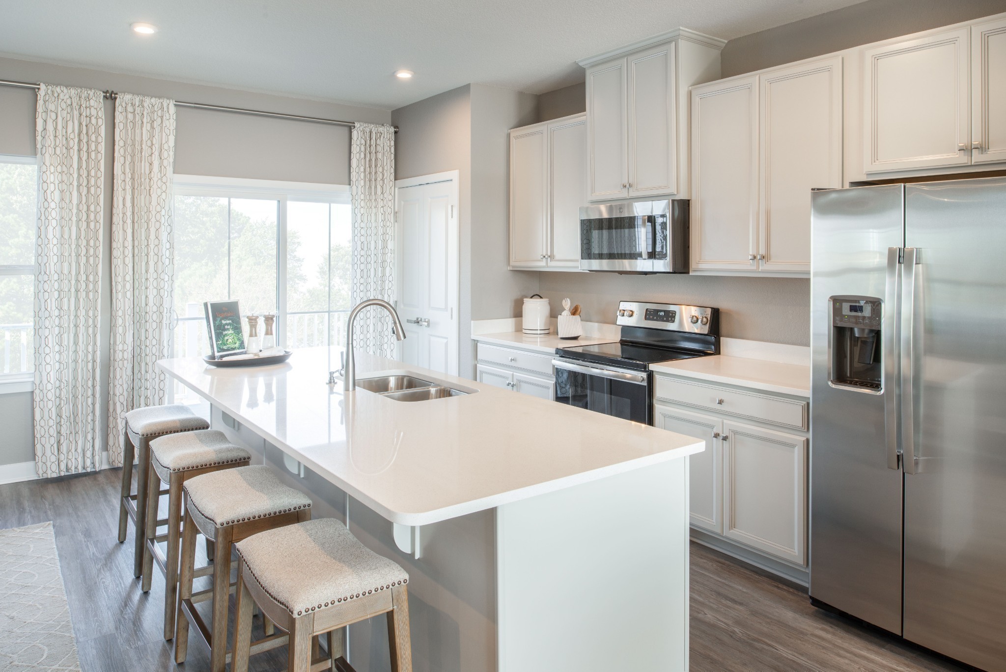 322 Poplar Loop Antioch, TN 37013 - Photo 3 of 20 a kitchen that has a lot of cabinets a sink and appliances in it