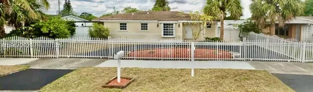 a view of a chair and table on the wooden floor