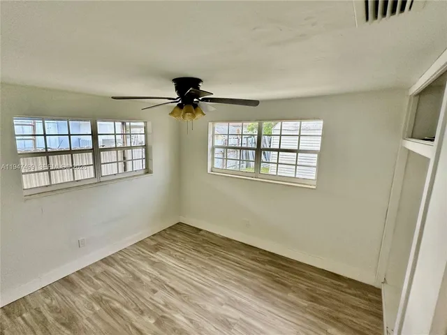 a view of empty room with windows