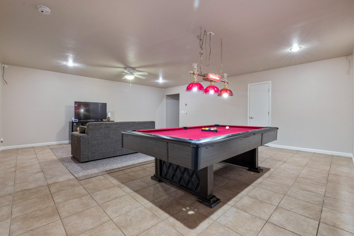 1084 Eastburg Court Ripon, CA 95366 - Photo 19 of 46 a room with pool table and flat screen tv