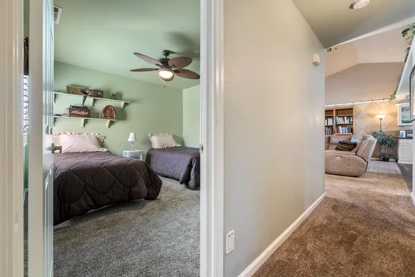 a bedroom with a bed and a couch