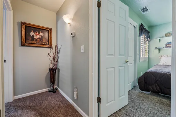 a view of bedroom with furniture and closet