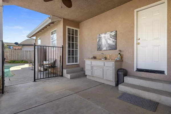 a view of washer and dryer with bathroom in the background