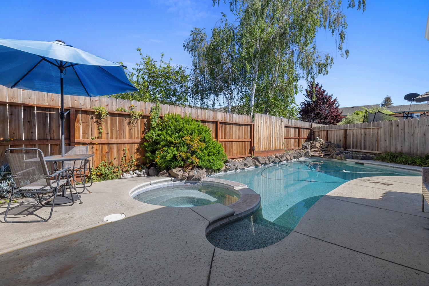 1084 Eastburg Court Ripon, CA 95366 - Photo 37 of 46 a view of a backyard with a patio table and chairs