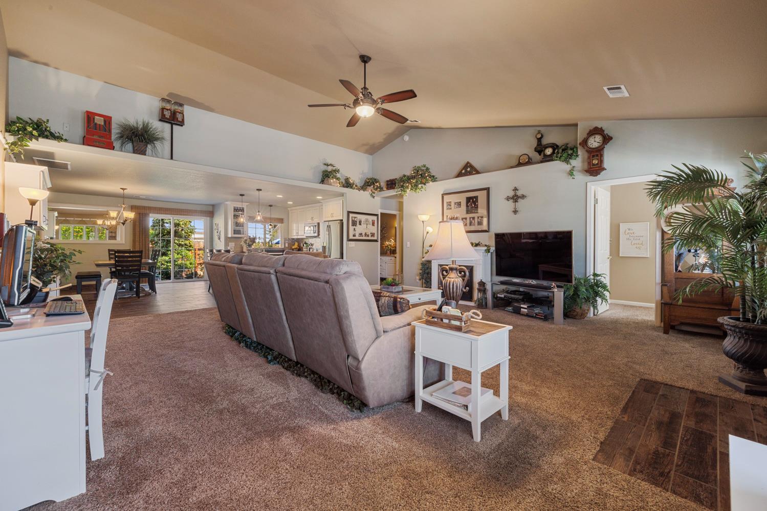 1084 Eastburg Court Ripon, CA 95366 - Photo 6 of 46 a living room with furniture and a flat screen tv