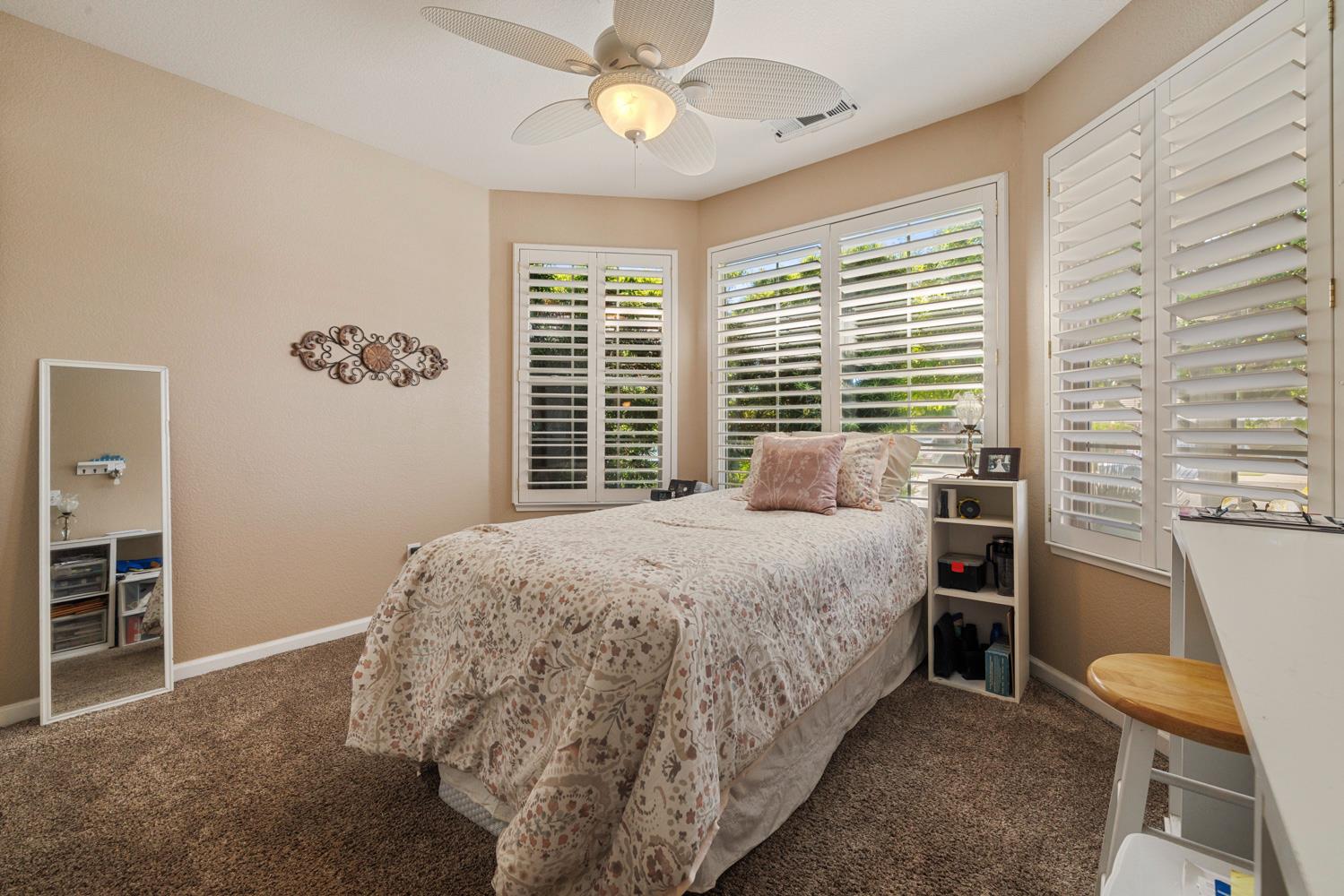 1084 Eastburg Court Ripon, CA 95366 - Photo 8 of 46 a bedroom with a bed and a window