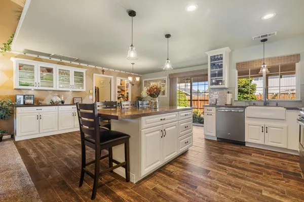 a kitchen with counter top space and appliances
