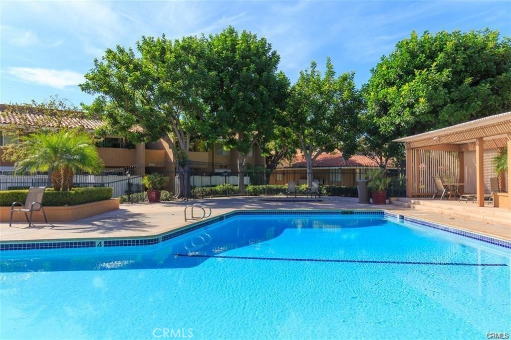1101 West MacArthur Boulevard Santa Ana, CA 92707 - Photo 12 of 16 a view of a house with pool and sitting area